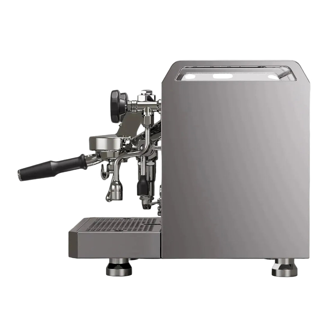 A modern semi-automatic espresso machine with a brushed silver metallic body, black handle, and stainless steel portafilter, shown from a side profile against a solid black background.