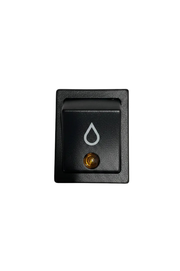 A square black rocker switch with a recessed button featuring a white droplet symbol and a small gold screw terminal, photographed on a plain off-white surface.